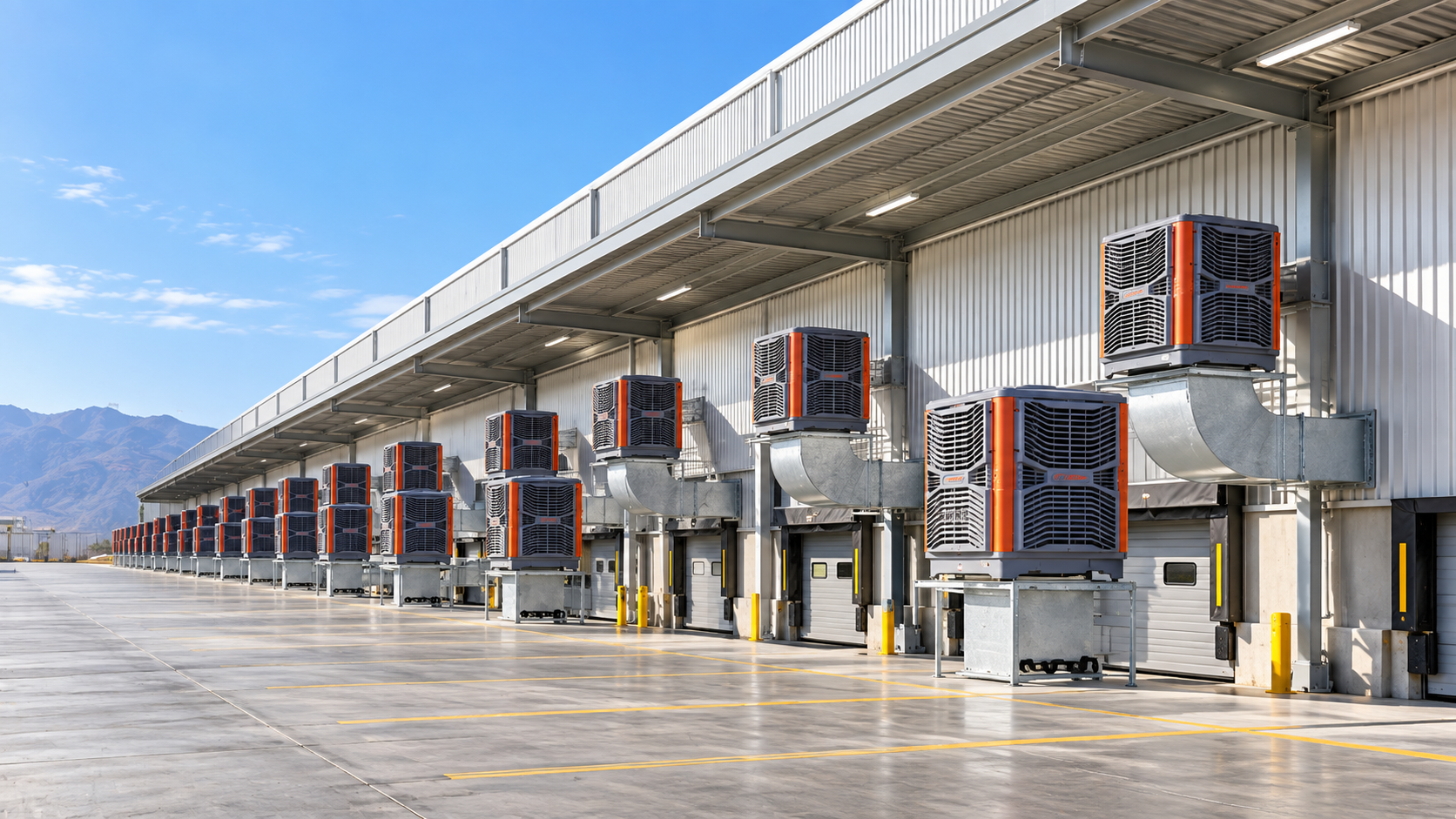 Heavy-duty evaporative air coolers installed along a factory loading dock