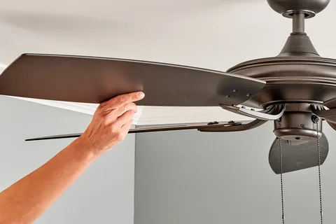 Ceiling fan maintenance improving airflow and workplace safety in forklift zones.