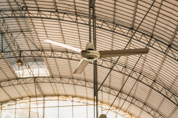 Ceiling fan circulating air to keep athletes comfortable in a covered sport hall.