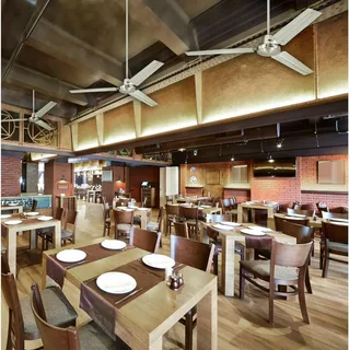 Ceiling fans in restaurant supporting energy efficiency and lowering cooling expenses.