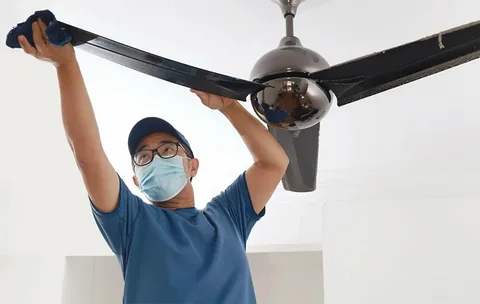 Ceiling fan cleaning supporting safe airflow in forklift and high traffic work zones.