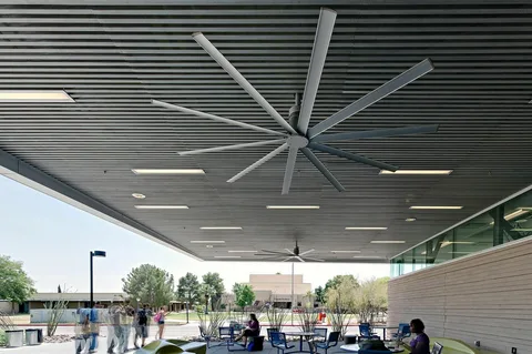 HVLS ceiling fan installed in airport patio to circulate fresh air and minimize lingering food odors.