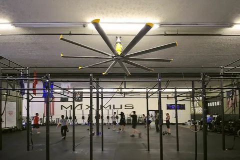 HVLS ceiling fan providing powerful airflow in packed sports facilities.